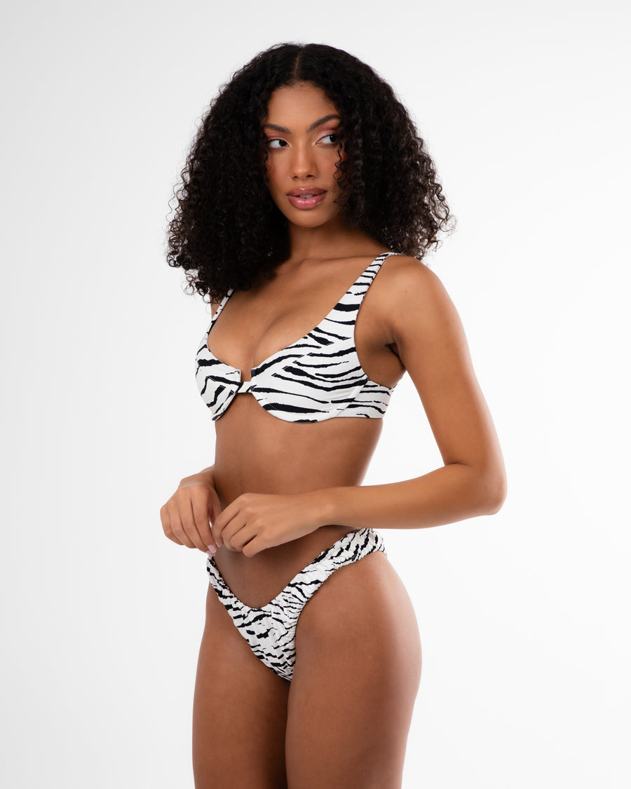 Women's sustainable cheeky bikini bottom in Zebra